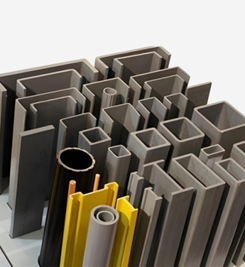 Fiber-reinforced plastic (FRP/GRP) structural profiles: C-channels, box sections, round tubes, I-beams, and angles in industrial finishes